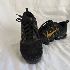 Nike Air Black and Gold Athletic Shoes